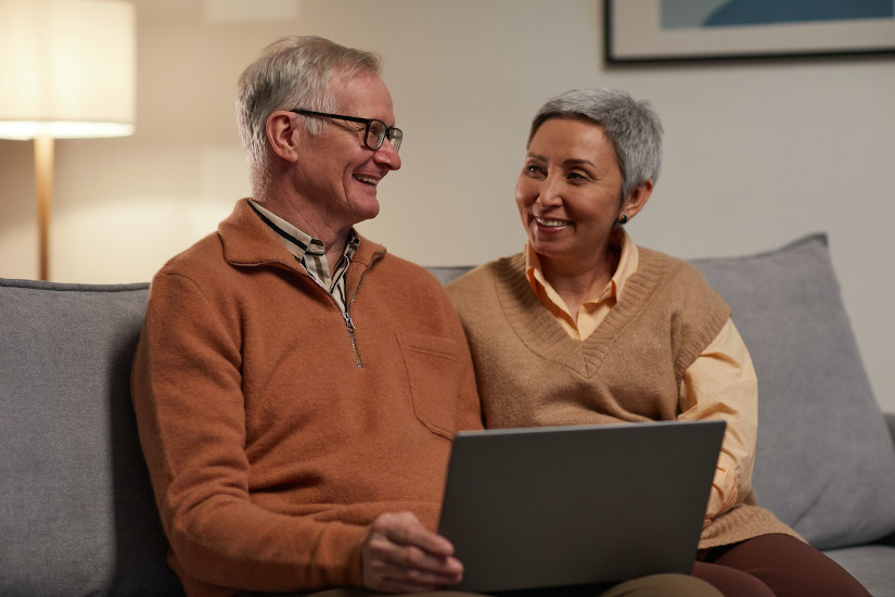 Man and woman sitting on sofa