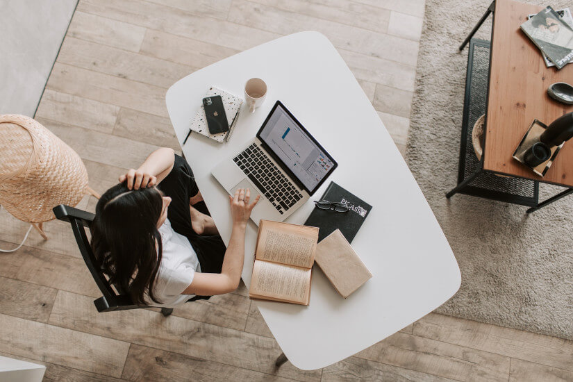 Woman using laptop in home office