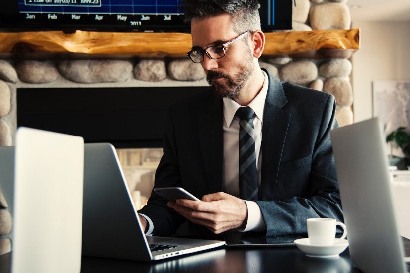 Man in suit holding phone