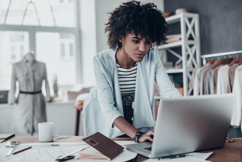 Woman using laptop on desk