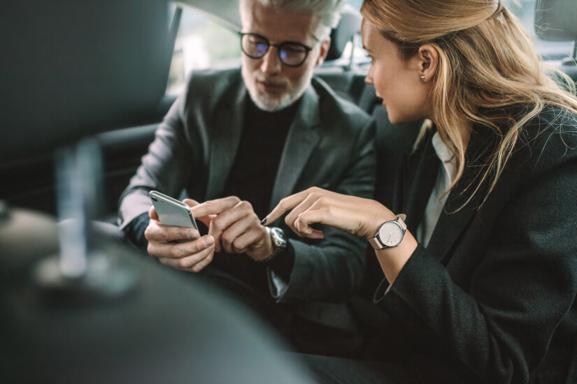 People using phone in car