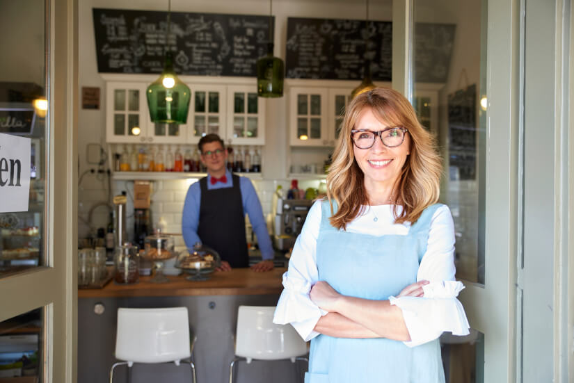 Business-woman-standing outside her cafe