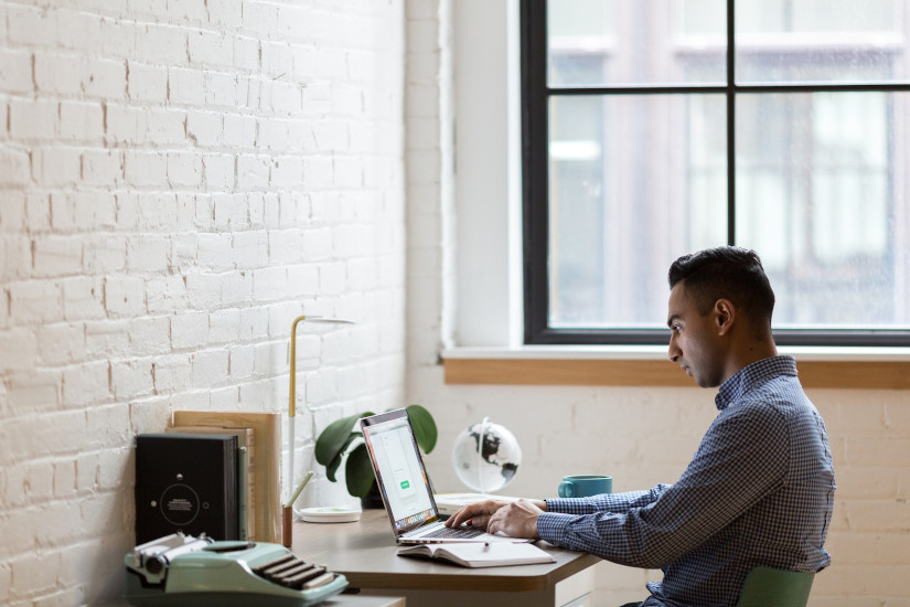 Man sitting using laptop